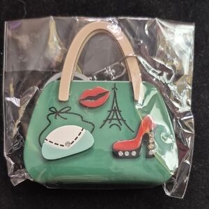 Charming Green Handbag Key Chain with Parisian Accents